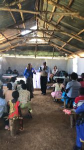 Sis Lisa preparing the way for Apostle John to introduce Apostle John