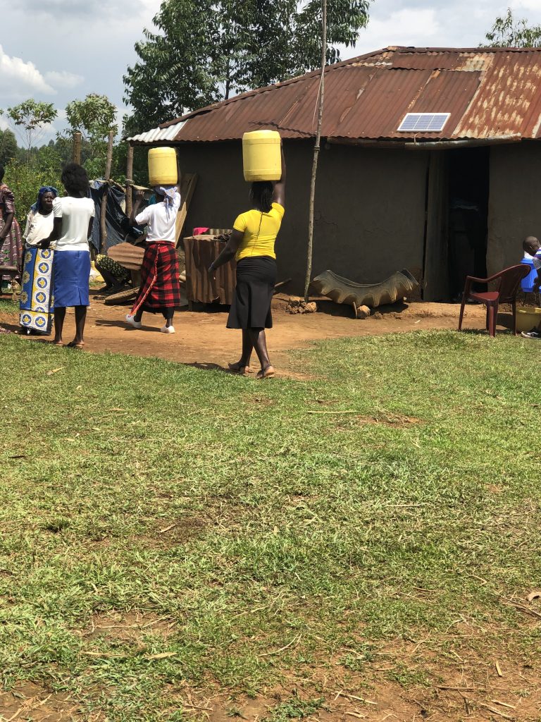 Carrying the water to the house